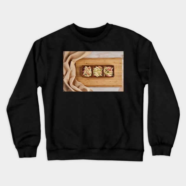 Colorful pasta on a wooden board Crewneck Sweatshirt by naturalis